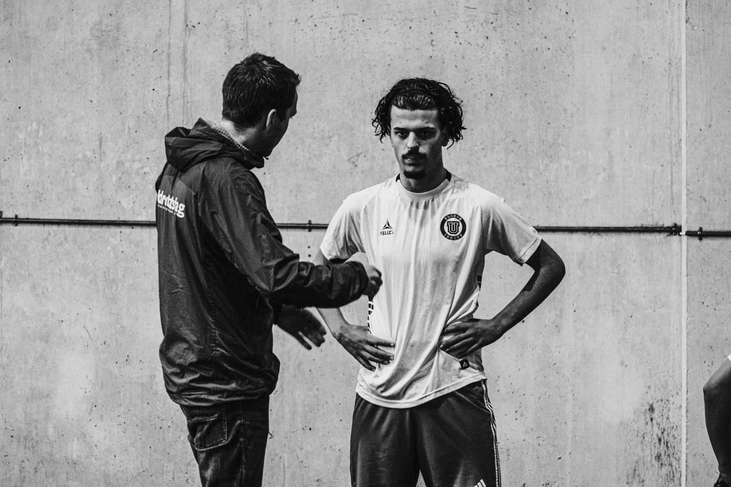 a man shaking another man's hand